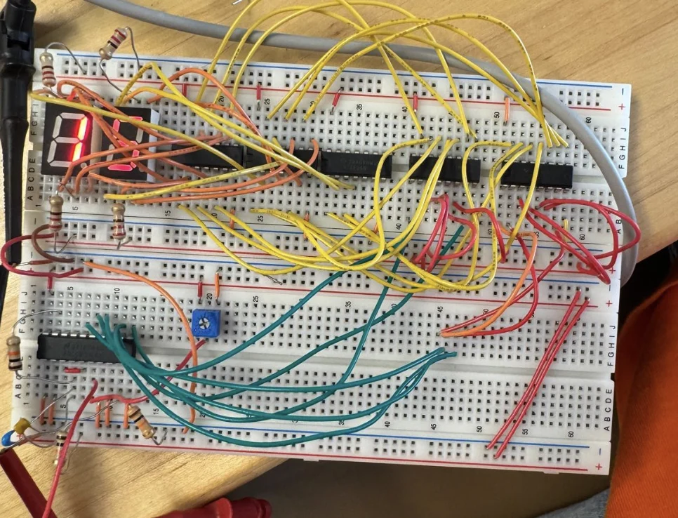Two-digit breadboard voltmeter with yellow jumper wires
